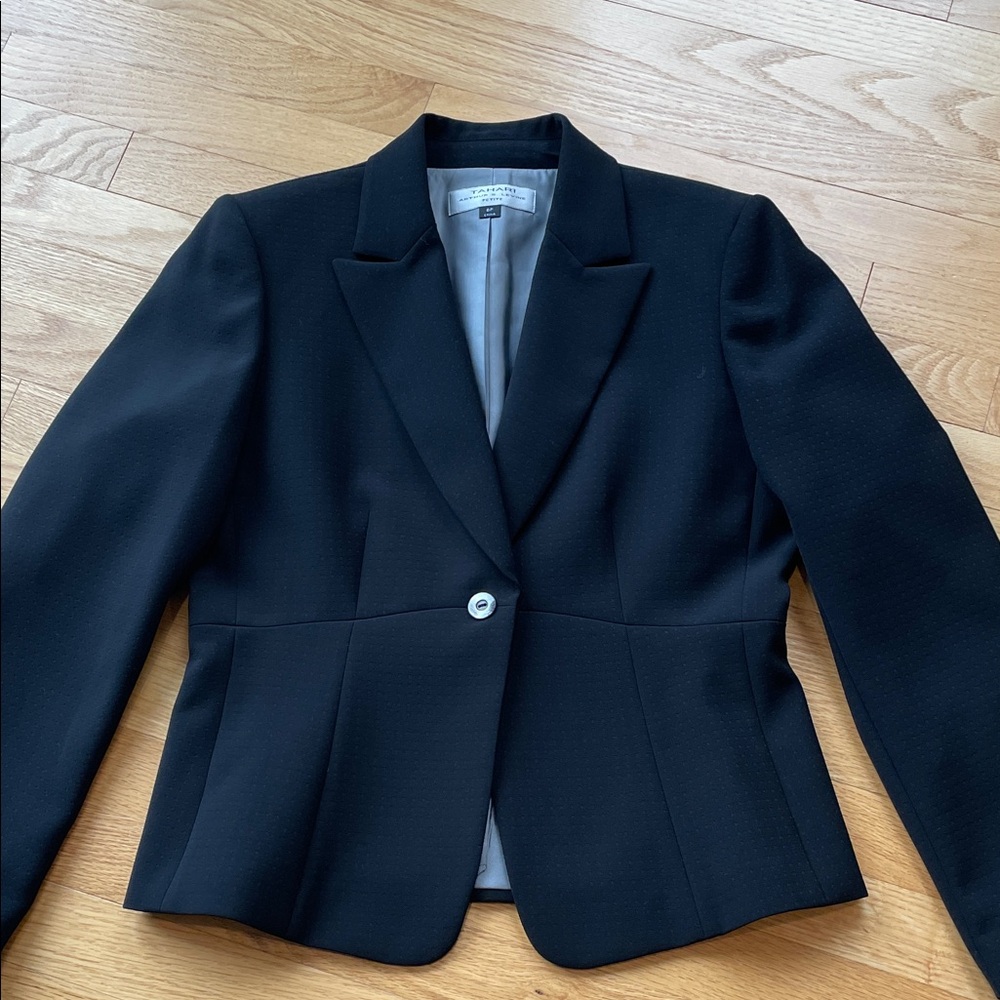 Worn once. Black textured fabric. Beautifully lined and tailored.